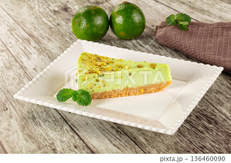 Green pistachio cheesecake served mint Green pistachio cheesecake served mint 136460090