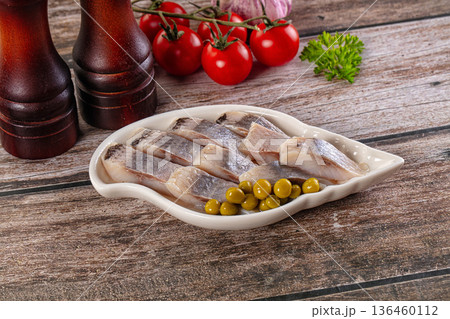 Slided marinated salted herring fillet 136460112