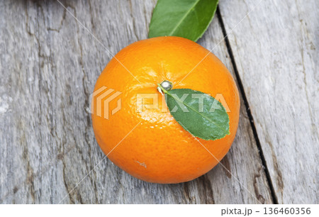 Oranges healthy fruit is placed on wooden floor. Oranges healthy fruit is placed on wooden floor. 136460356