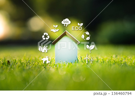 Sustainable home concept with eco-friendly icons on green grass. Sustainable home concept with eco-friendly icons on green grass. 136460794