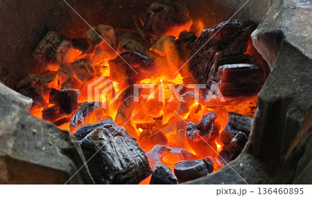 The charcoal in the stove is burning. The charcoal in the stove is burning. 136460895