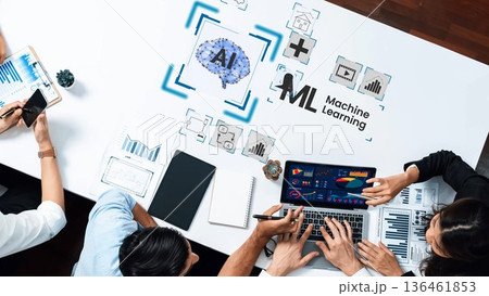 Professionals Collaborating on Artificial Intelligence and Machine Learning Data Analysis with Laptop and Graphics on Table Gluon 136461853