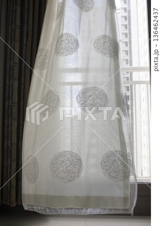 It's a curtain blowing in the wind 136462437