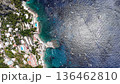 Vibrant coastal beauty of Capri showcasing its stunning shoreline and azure waters 136462810