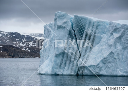 massive iceberg near the coast of Greenland with rack forming the American flag massive iceberg near the coast of Greenland with rack forming the American flag 136463307