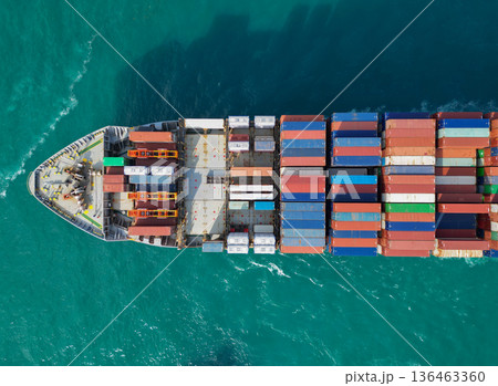 Cargo business. Container ship. Shipping logistics. Commercial shipping. Cargo ship in sea, aerial view. Freight container on cargo vessel. Aerial view cargo ship entering harbor. Heavy-duty vessel Cargo business. Container ship. Shipping logistics. Commercial shipping. Cargo ship in sea, aerial view. Freight container on cargo vessel. Aerial view cargo ship entering harbor. Heavy-duty vessel 136463360