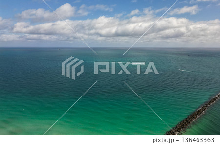 Calm horizon view at sea nature. Romantic summer vacation view on seascape. Sea horizon view. Cloudy sky and seascape at summer vacation. Skyscape with sea horizon. Clear water 136463363