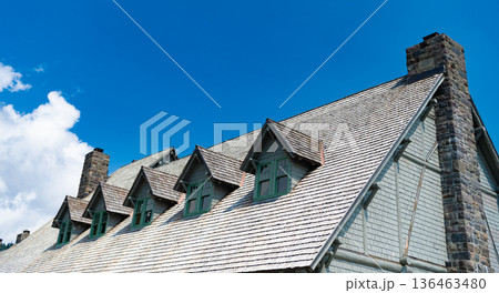House rooftop with nobody. Roof tiles architecture. Architectural grey rooftop exterior. Rooftop with windows. Roof of the house House rooftop with nobody. Roof tiles architecture. Architectural grey rooftop exterior. Rooftop with windows. Roof of the house 136463480