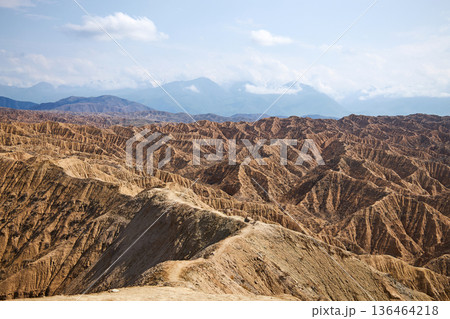Desert landscape of Aksai Canyon in Kyrgyzstan. Natural rock formations and erosion patterns. Scenic view for travel destination. 136464218