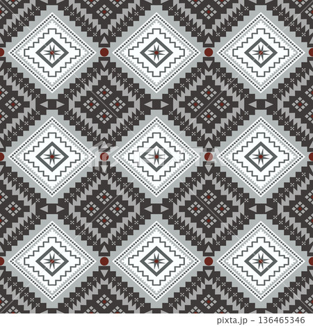 Traditional ethnic seamless pattern featuring geometric diamond shapes in grey, white and brown tone 136465346