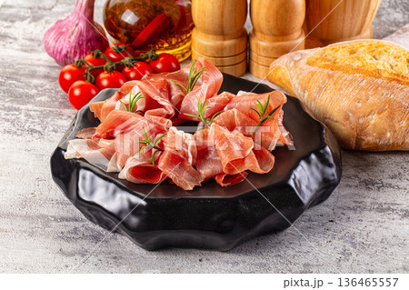 Spanish dry jamon serrano pork meat slices Spanish dry jamon serrano pork meat slices 136465557