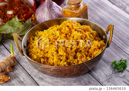 Indian yellow curry rice with tumeric 136465610