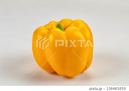 Ripe yellow sweet peppers on a dark textured background Ripe yellow sweet peppers on a dark textured background 136465850