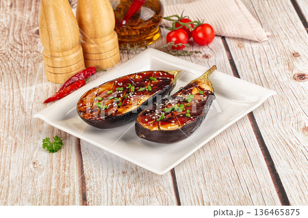 Baked eggplant with teriyaki sause 136465875