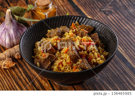 Asian traditional pilaf with beef 136465985