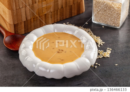 Asian sesame sauce with seeds 136466133