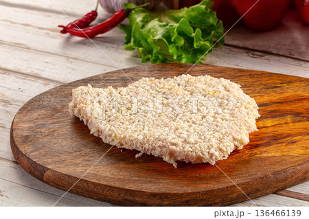 Raw breaded schnitzel for roast Raw breaded schnitzel for roast 136466139