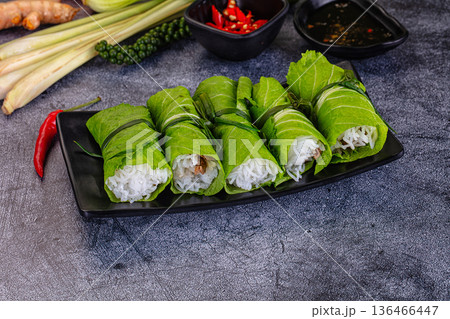 Vietnamese green nem spring rolls in leaf 136466447