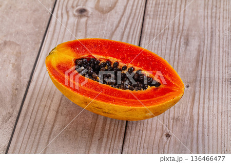 Sweet juicy tropical papaya cut half 136466477