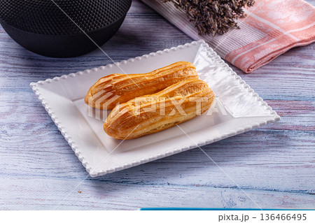 Sweet baked eclair dessert with cream Sweet baked eclair dessert with cream 136466495