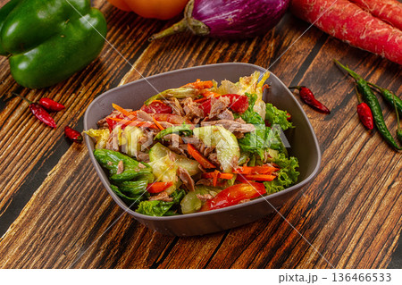 Fresh Tuna Salad with Vegetables in a Bowl on a Rustic Wooden Table 136466533