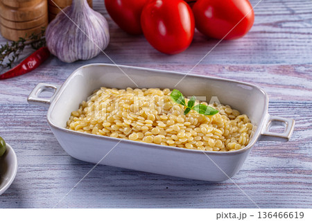 Boiled ptitim pasta served basil 136466619