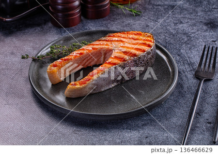Grilled salmon steak served thyme Grilled salmon steak served thyme 136466629