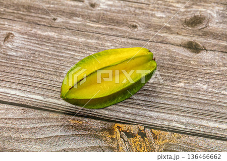 Fresh starfruit or carambola on a textured background. Fresh starfruit or carambola on a textured background. 136466662