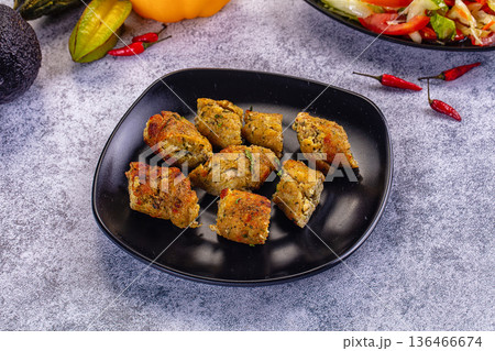 Chicken and vegetable kebab on a plate with fresh salad and ingredients Chicken and vegetable kebab on a plate with fresh salad and ingredients 136466674