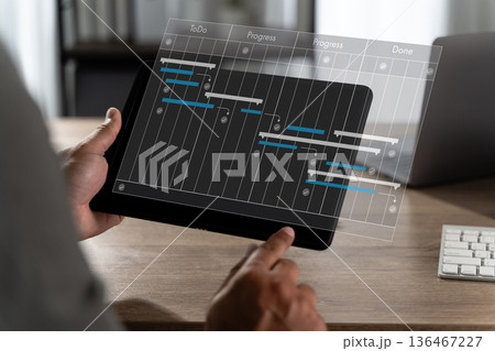 Project planning concept with timeline bars and progress columns manager reviews tasks, deadlines, and workflow status project management dashboard 136467227
