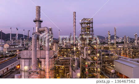 Aerial view oil and gas petrochemical storage tank with oil and gas refinery plant at twilight, Global business power and energy petrochemical industry, Oil and gas refinery petrochemical industrial. Aerial view oil and gas petrochemical storage tank with oil and gas refinery plant at twilight, Global business power and energy petrochemical industry, Oil and gas refinery petrochemical industrial. 136467562