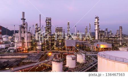Aerial view oil and gas petrochemical storage tank with oil and gas refinery plant at twilight, Global business power and energy petrochemical industry, Oil and gas refinery petrochemical industrial. Aerial view oil and gas petrochemical storage tank with oil and gas refinery plant at twilight, Global business power and energy petrochemical industry, Oil and gas refinery petrochemical industrial. 136467563