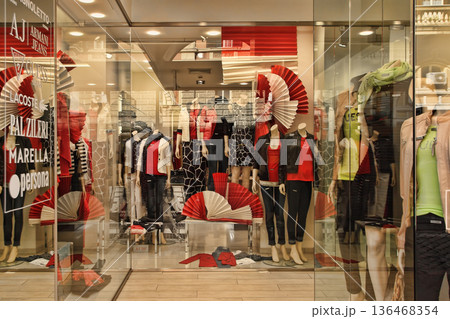 ROMA, ITALY, APRIL 10, 2016 : Entrance to a modern fashion boutique in the center of Rome, Italy. ROMA, ITALY, APRIL 10, 2016 : Entrance to a modern fashion boutique in the center of Rome, Italy. 136468354