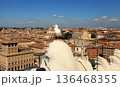 Seagull on the outlook above historical center of Rome. Seagull stands over the roofs of Roma. Seagull watching Rome in summer. Bird on rooftops in the historic city center. 136468355