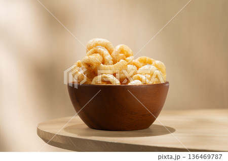 Kap Moo Crispy Pork Rinds in Wooden Bowl, Traditional Thai Snack 136469787