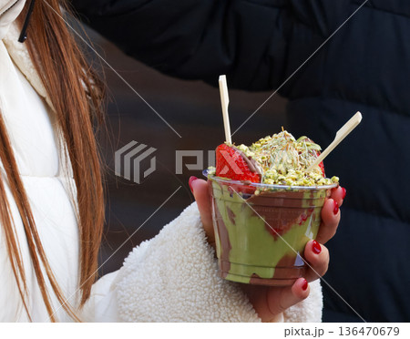 Bowl with fresh strawberries and Dubai-style chocolate 136470679
