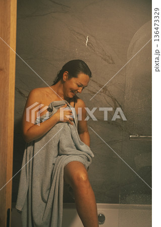 Woman Smiling After Shower Wrapped in Towel Woman Smiling After Shower Wrapped in Towel 136473329