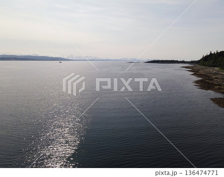 Isle of skye coastline view with shimmering sea Isle of skye coastline view with shimmering sea 136474771