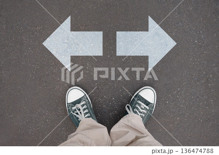 Two arrows - choice concept - legs with trainer shoes 136474788