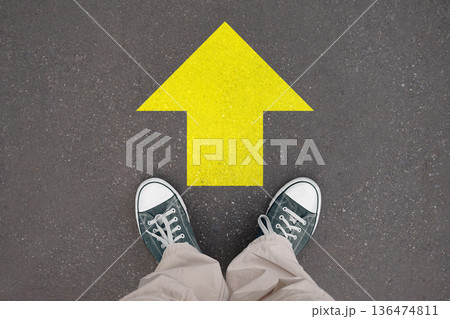 Forward concept, arrow - legs with trainer shoes Forward concept, arrow - legs with trainer shoes 136474811