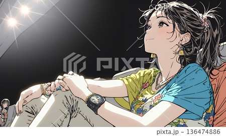 映画や演劇を鑑賞している若い女性