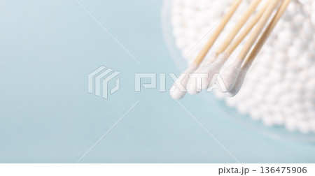 Cleaning tools cotton buds on blue background Cleaning tools cotton buds on blue background 136475906