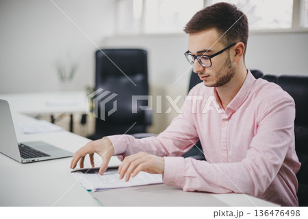 Young man in the office Young man in the office 136476498