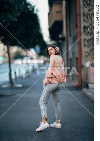 Young girl on street 136476532