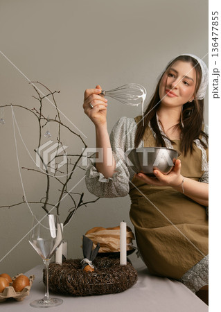 Home Easter preparation woman making white glaze for traditional Easter cake Home Easter preparation woman making white glaze for traditional Easter cake 136477855