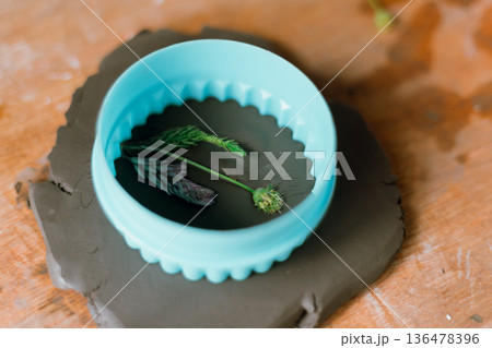 The process of creating pottery.  136478396