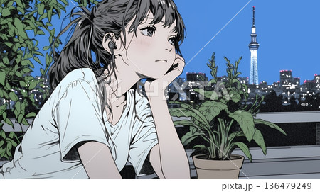 ベランダで夜風に当たりながら都会のランドスケープを眺め休む若い女性