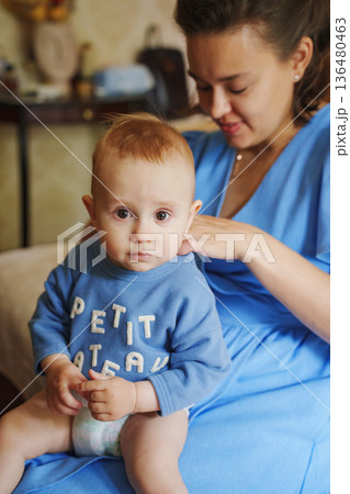 Mother and child share a quiet moment together Mother and child share a quiet moment together 136480463