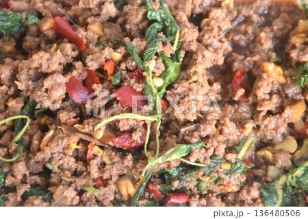 spicy stir fried chop beef meat with chili and basil in clear plastic box for take home on table spicy stir fried chop beef meat with chili and basil in clear plastic box for take home on table 136480506