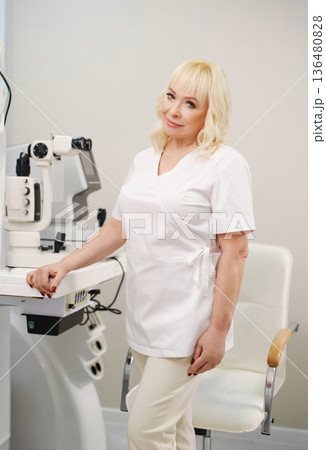 Ophthalmologist in office ready to assist patients 136480828